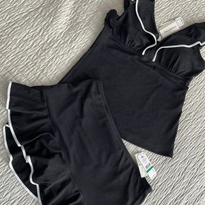 Two piece black with white piping bathing suit. Never worn